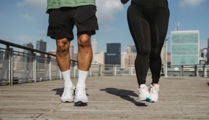Representative photograph of two people jogging on a track